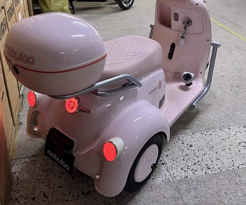triciclo eléctrico rosa